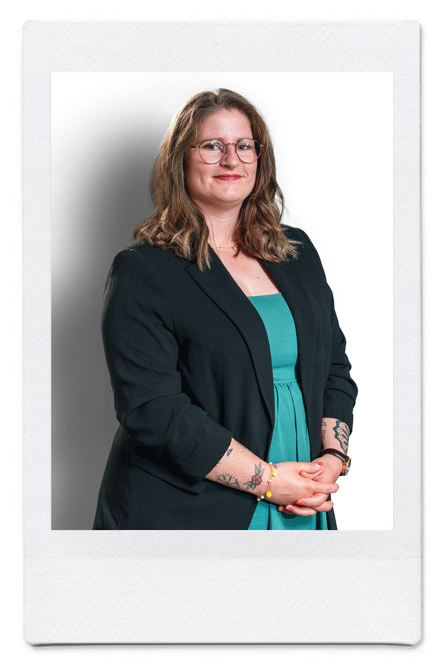 Portrait of Emmanuelle Furrer, patent assistant at Katzarov SA, smiling in a green dress and blazer.