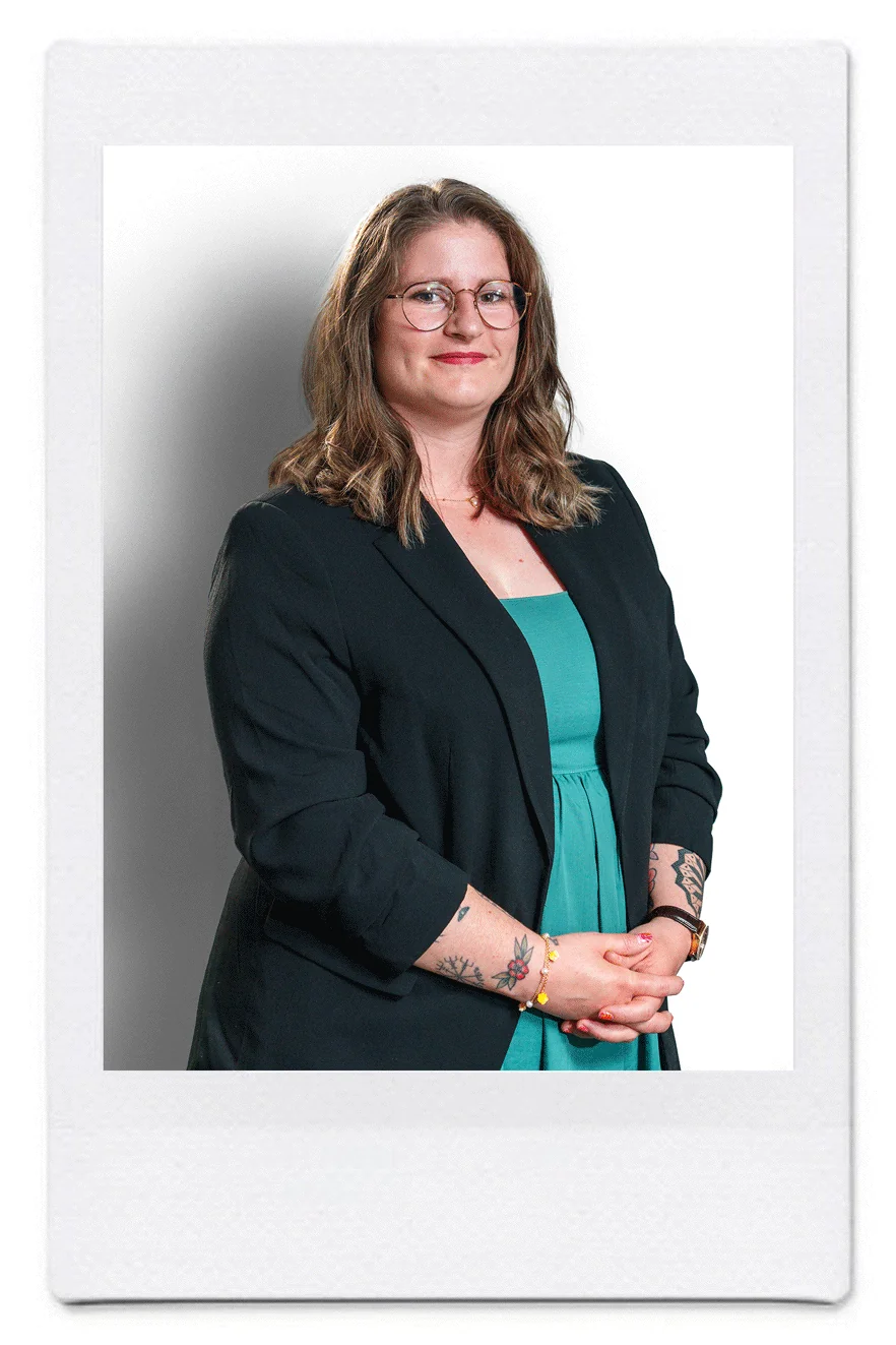 Portrait of Emmanuelle Furrer, patent assistant at Katzarov SA, smiling in a green dress and blazer.